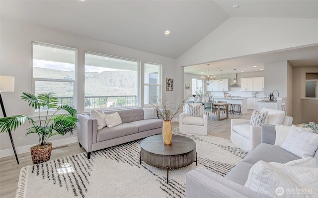 1580 S Kelvin Ct, East Wenatchee, WA 98802 - living room with light wood finished floors, recessed lighting, and high vaulted ceiling