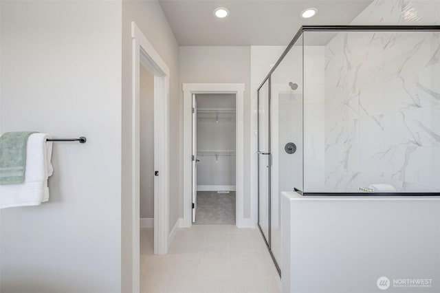 1580 S Kelvin Ct, East Wenatchee, WA 98802 - bathroom featuring a shower stall, a spacious closet, recessed lighting, baseboards, and tile patterned flooring
