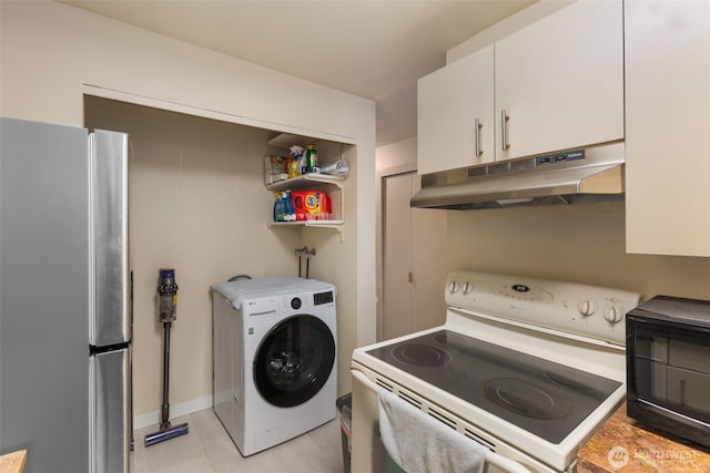 2534 S 317th St Unit 103, Federal Way, WA 98003 - laundry area with light tile patterned floors, washer / clothes dryer, and laundry area