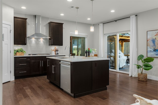 1221 199th St SE, Bothell, WA 98012 - kitchen featuring wall chimney exhaust hood, a sink, appliances with stainless steel finishes, light countertops, and dark wood-style floors