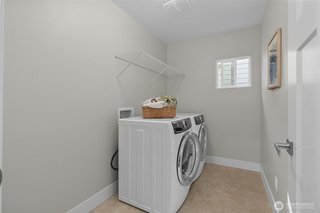1221 199th St SE, Bothell, WA 98012 - laundry area featuring washing machine and clothes dryer and baseboards
