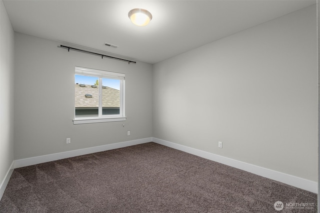 1221 199th St SE, Bothell, WA 98012 - empty room featuring dark carpet and baseboards