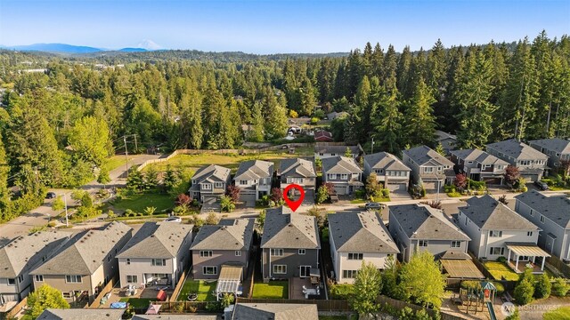 1221 199th St SE, Bothell, WA 98012 - aerial view of property's location with nearby suburban area and a forest