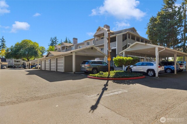 215 100th St SW Unit B307, Everett, WA 98204 - partially covered parking lot with community garages