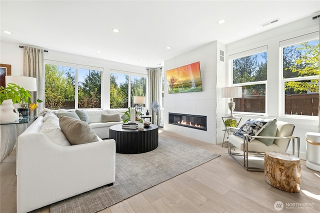 sunroom / solarium featuring visible vents and a wealth of natural light