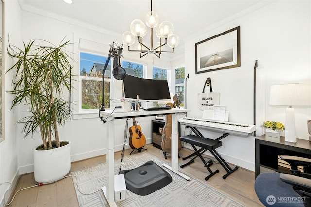 office area featuring ornamental molding, a chandelier, wood finished floors, and a healthy amount of sunlight
