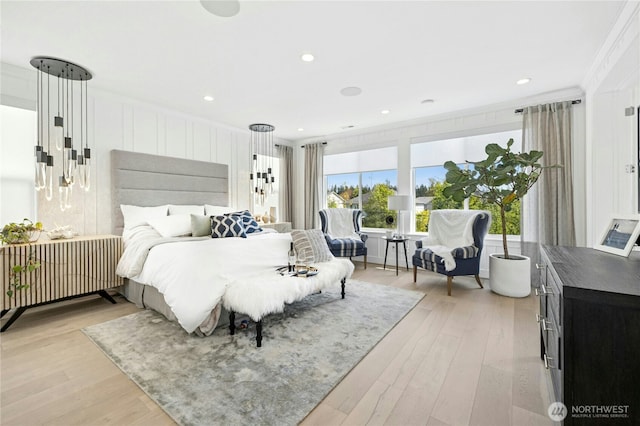 bedroom featuring crown molding, light wood-style flooring, and recessed lighting