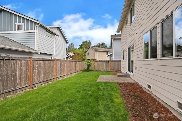 view of yard featuring a fenced backyard