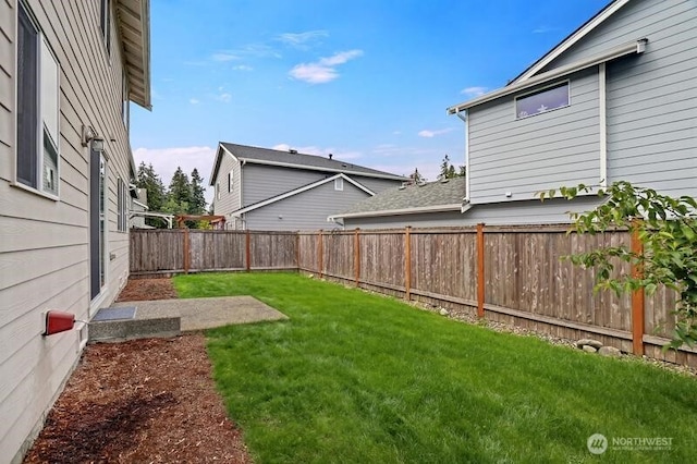 view of yard featuring a fenced backyard