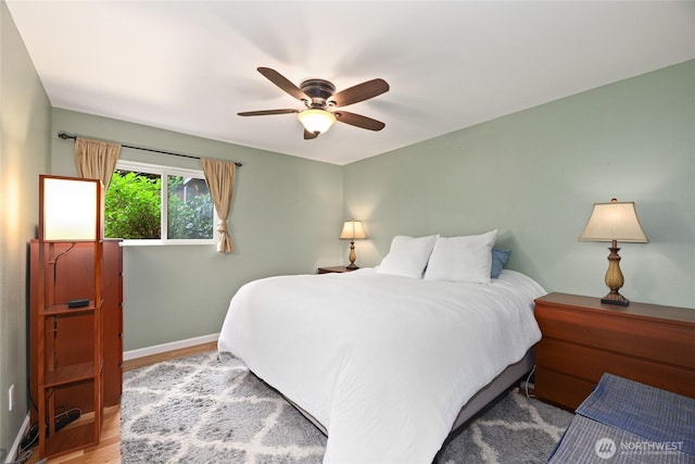 2858 32nd Ave W Unit 102, Seattle, WA 98199 - bedroom featuring baseboards, ceiling fan, and wood finished floors
