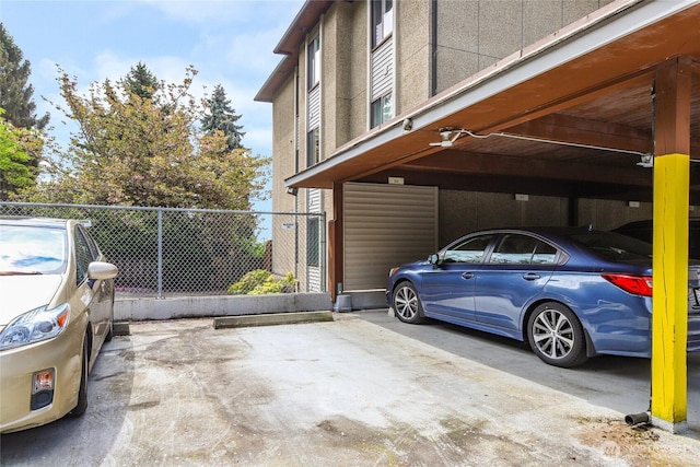2858 32nd Ave W Unit 102, Seattle, WA 98199 - view of side of home featuring covered parking and fence