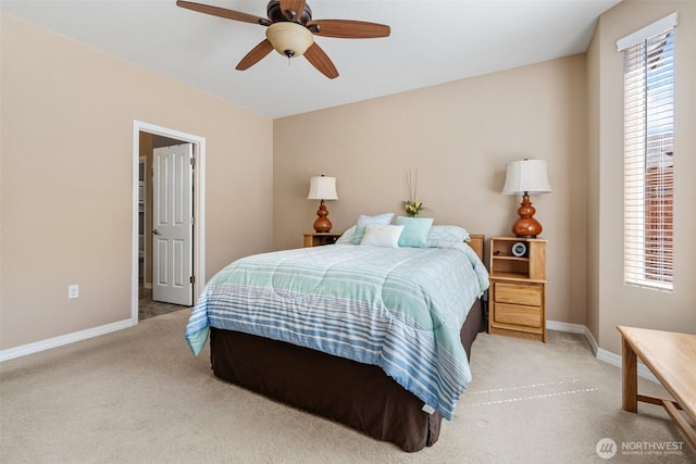 bedroom with baseboards, ceiling fan, and light colored carpet