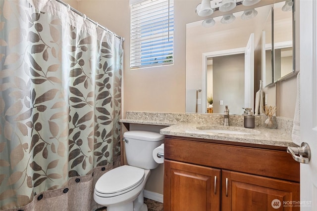 full bathroom featuring toilet and vanity
