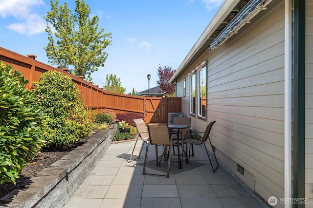 view of patio / terrace featuring outdoor dining area and a fenced backyard