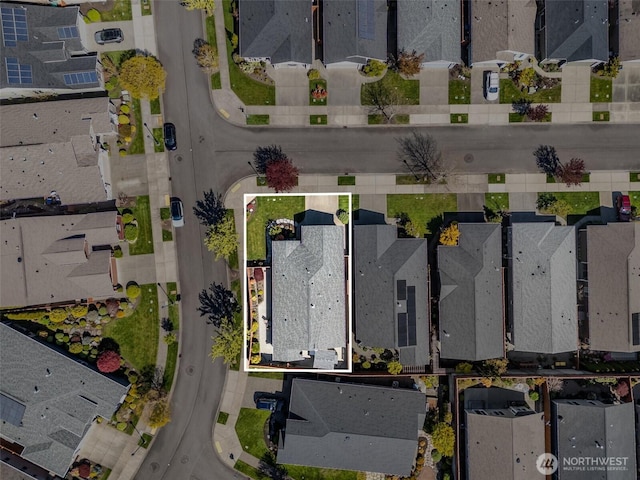 birds eye view of property with a residential view