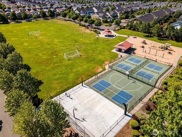 birds eye view of property with a residential view