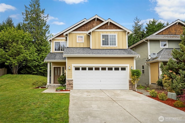 3639 Reagan Ave, Bremerton, WA 98310 - craftsman-style house featuring board and batten siding, driveway, a front yard, an attached garage, and stone siding