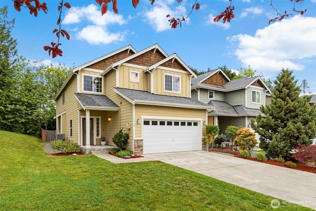 3639 Reagan Ave, Bremerton, WA 98310 - craftsman-style home featuring board and batten siding, concrete driveway, a front lawn, an attached garage, and stone siding