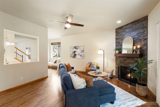 3639 Reagan Ave, Bremerton, WA 98310 - living room with wood finished floors, stairs, baseboards, ceiling fan, and a fireplace