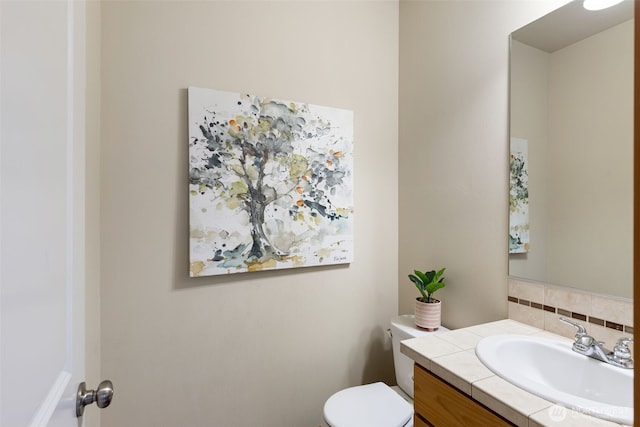 3639 Reagan Ave, Bremerton, WA 98310 - half bath with decorative backsplash, vanity, and toilet