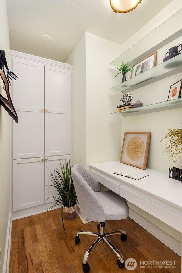 office with light wood-style flooring