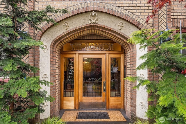 property entrance with brick siding