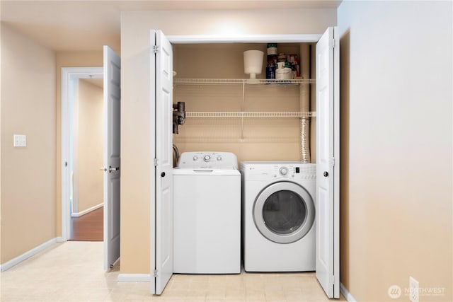 177 107th Ave NE Unit 1501, Bellevue, WA 98004 - clothes washing area with independent washer and dryer and baseboards