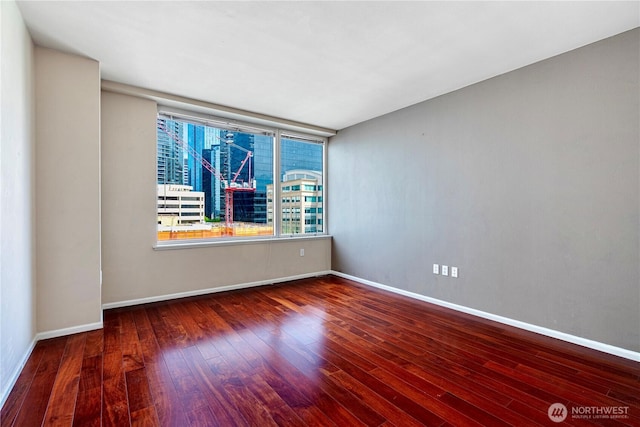 177 107th Ave NE Unit 1501, Bellevue, WA 98004 - empty room with hardwood / wood-style floors and baseboards