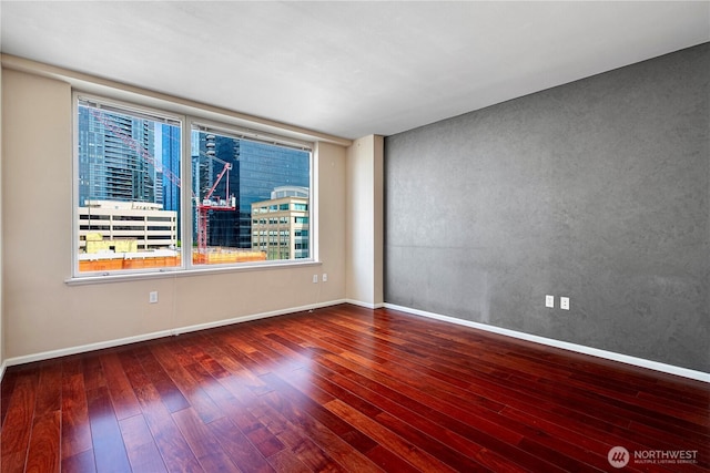 177 107th Ave NE Unit 1501, Bellevue, WA 98004 - unfurnished room with hardwood / wood-style flooring and baseboards