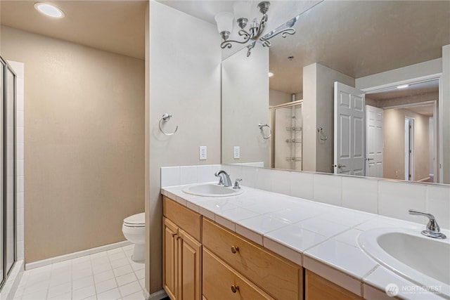177 107th Ave NE Unit 1501, Bellevue, WA 98004 - full bathroom featuring a shower stall, toilet, baseboards, double vanity, and recessed lighting
