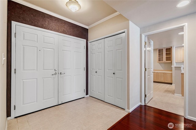 177 107th Ave NE Unit 1501, Bellevue, WA 98004 - unfurnished bedroom featuring baseboards, a closet, light wood finished floors, and ornamental molding