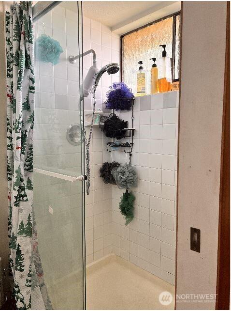full bathroom with a stall shower