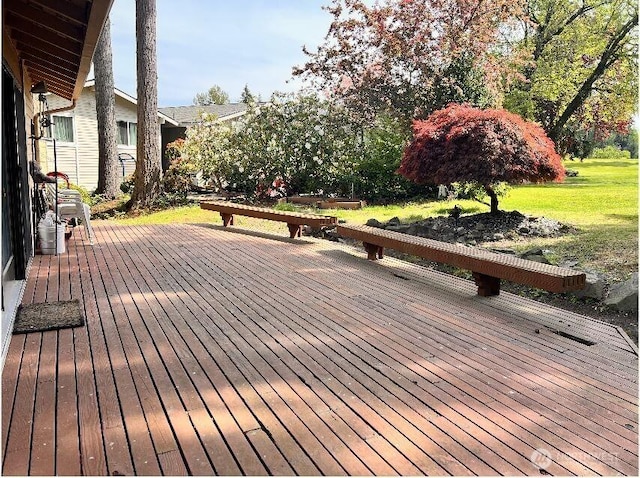 deck featuring a yard