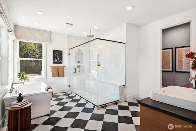 13748 SE 84th St Unit 17, Newcastle, WA 98059 - full bathroom with recessed lighting, tile patterned floors, a freestanding bath, baseboards, and a stall shower