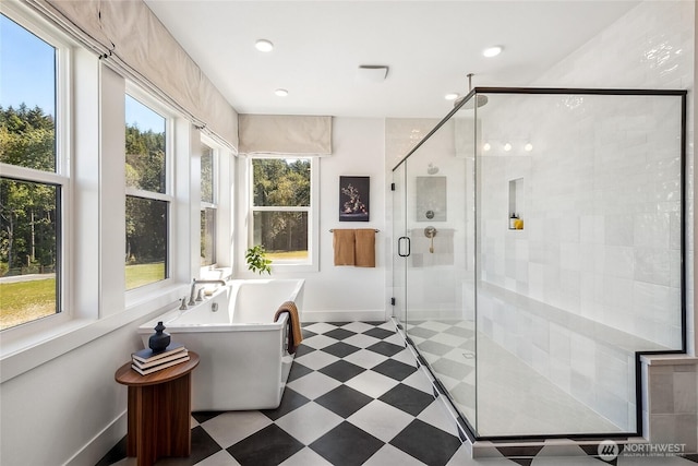 13748 SE 84th St Unit 17, Newcastle, WA 98059 - bathroom with a shower stall, baseboards, a freestanding tub, and recessed lighting