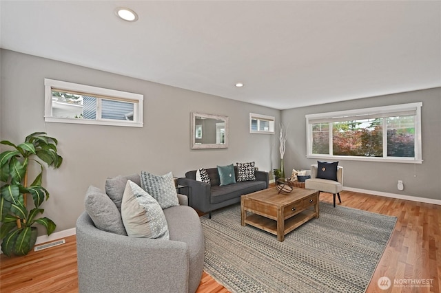 10839 35th Ave SW, Seattle, WA 98146 - living area with baseboards, light wood-style floors, and recessed lighting