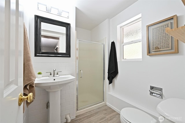 10839 35th Ave SW, Seattle, WA 98146 - full bathroom with toilet, a stall shower, wood finished floors, tasteful backsplash, and a sink