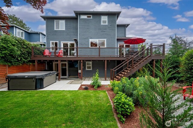 10839 35th Ave SW, Seattle, WA 98146 - back of property featuring a hot tub, a wooden deck, a patio, and stairs