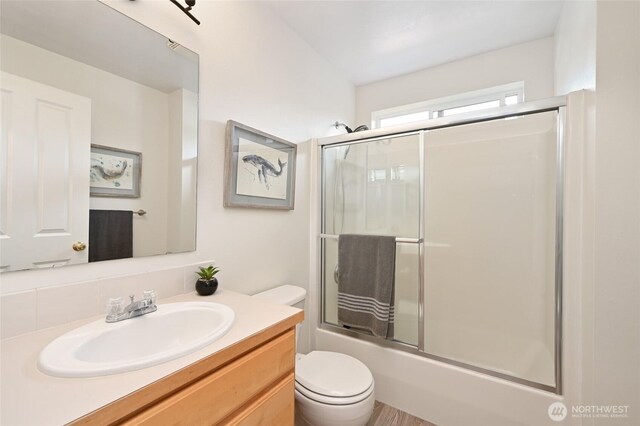 10839 35th Ave SW, Seattle, WA 98146 - full bath featuring vanity, toilet, and enclosed tub / shower combo