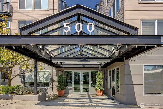property entrance featuring french doors