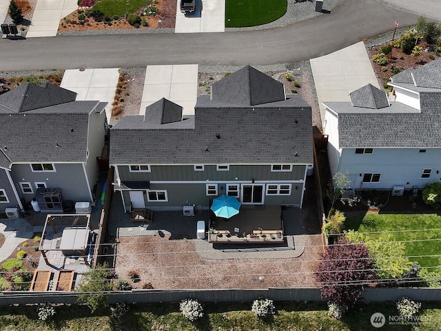 birds eye view of property with a residential view