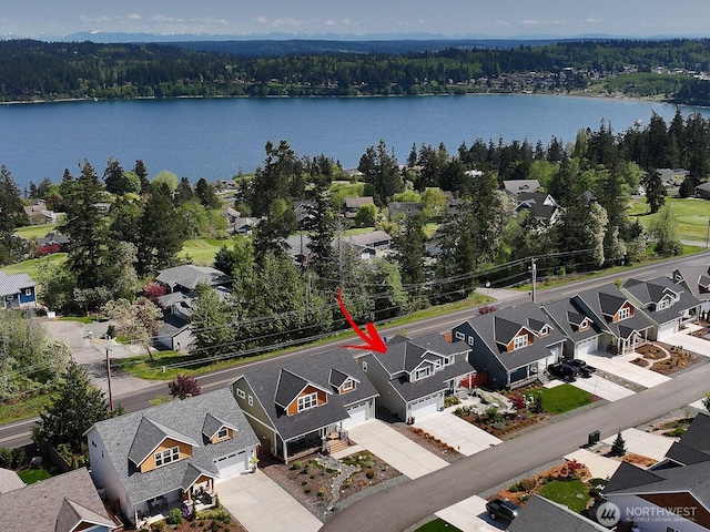 bird's eye view with a residential view and a view of trees