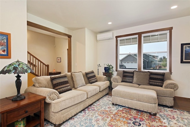 living area with recessed lighting, a wall mounted AC, and stairs