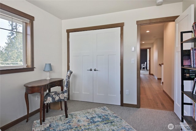 carpeted office space with baseboards and recessed lighting