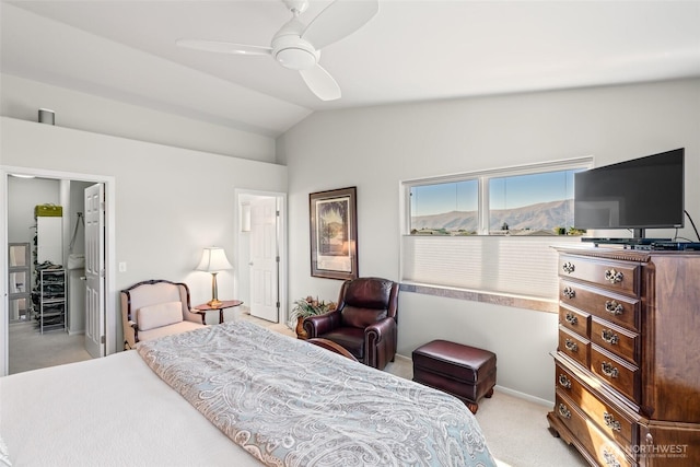 bedroom featuring light colored carpet, ceiling fan, and vaulted ceiling