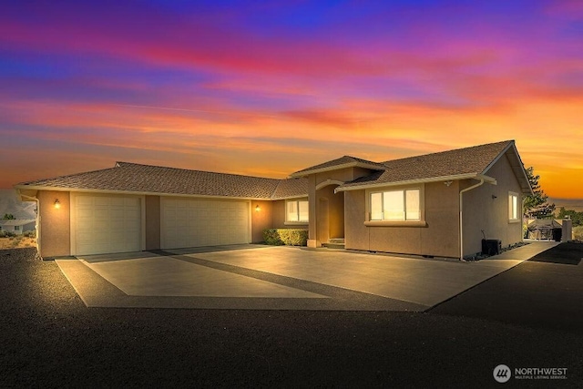 view of front of house featuring driveway and an attached garage