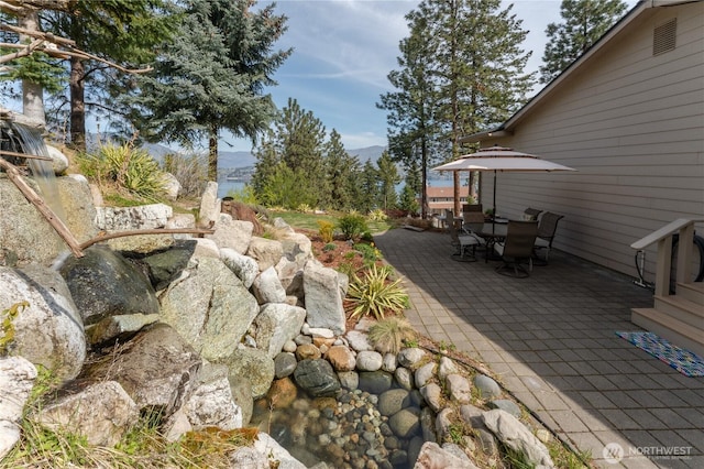 7379 Ridgeview Dr, Chelan, WA 98816 - exterior space with outdoor dining space and a mountain view