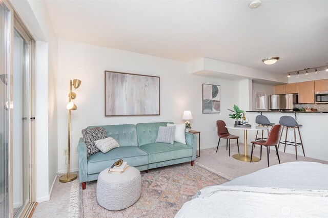 412 11th Ave Unit 309, Seattle, WA 98122 - living area with baseboards and light carpet