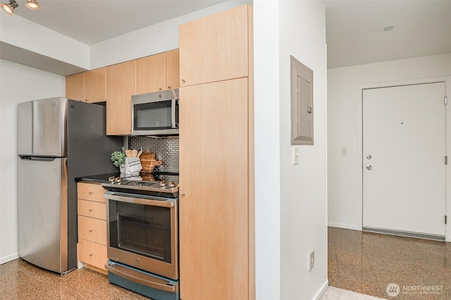 412 11th Ave Unit 309, Seattle, WA 98122 - kitchen featuring decorative backsplash, electric panel, appliances with stainless steel finishes, baseboards, and light brown cabinets