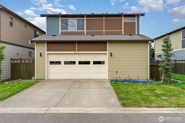 view of front of home featuring a garage, fence, concrete driveway, and roof with shingles